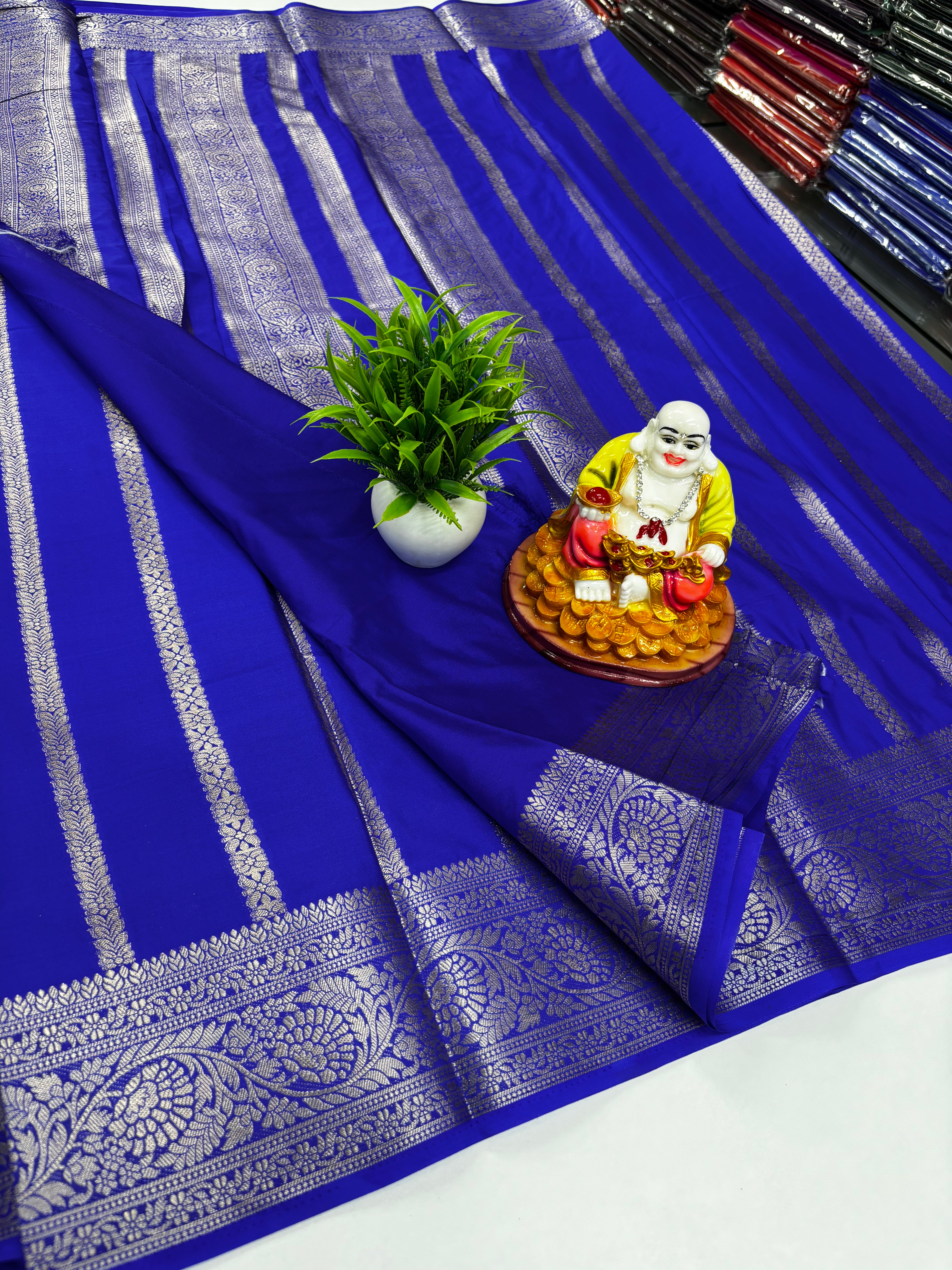 Elegant Mysore crêpe silk saree with refined stripe motif and rich pallu — lightweight, drapey, and perfect for weddings & festive occasions.