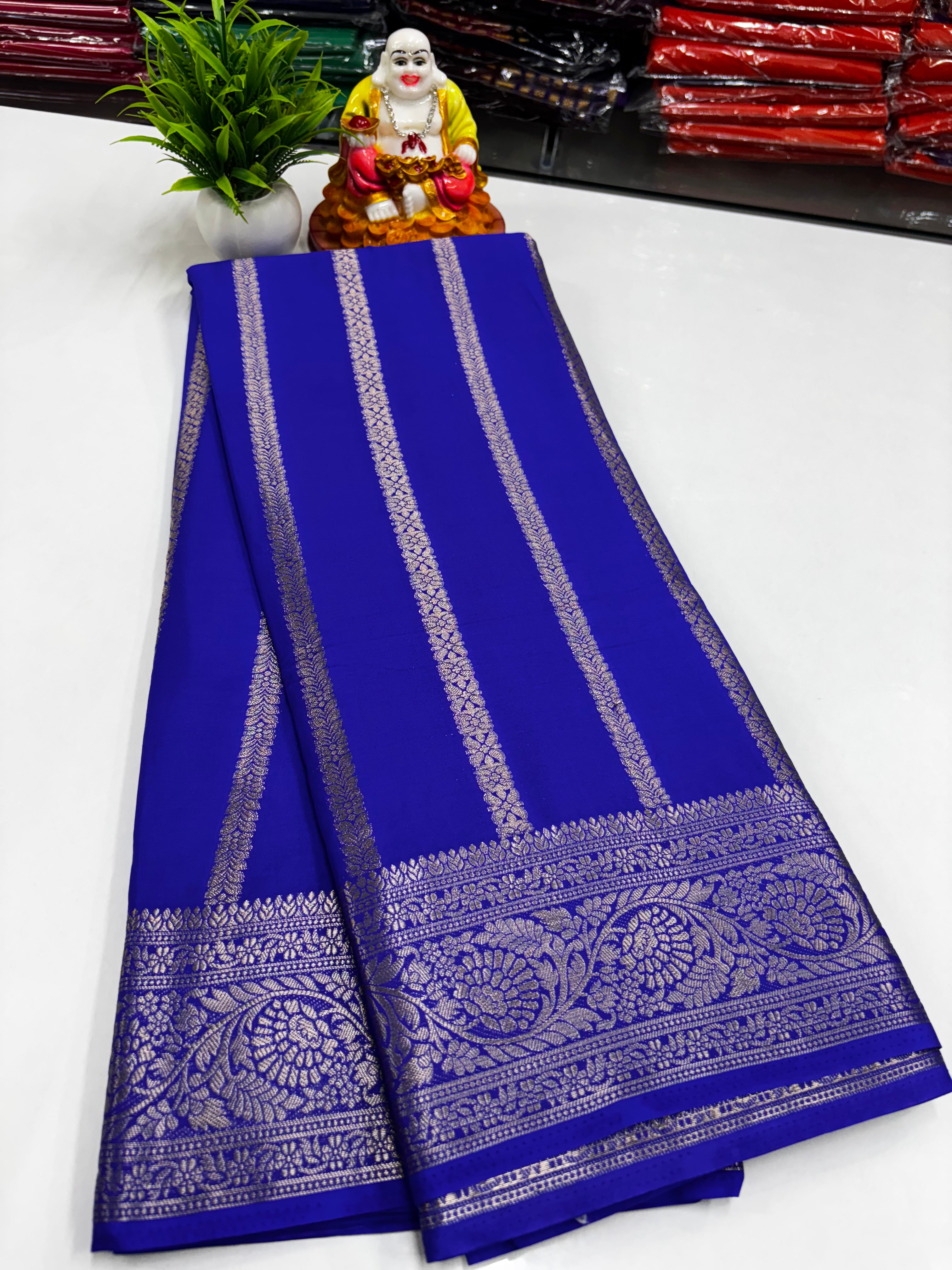 Elegant Mysore crêpe silk saree with refined stripe motif and rich pallu — lightweight, drapey, and perfect for weddings & festive occasions.