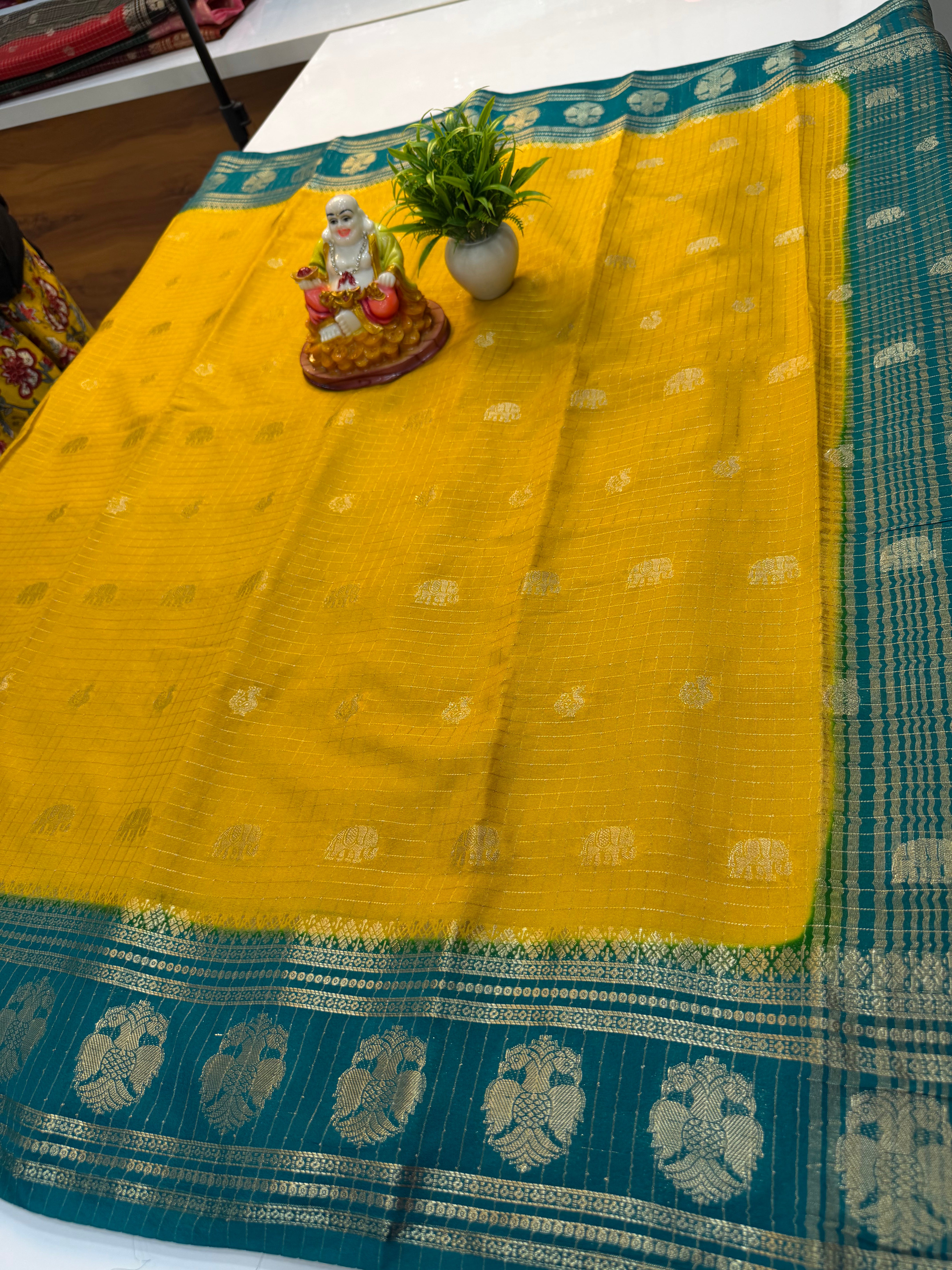 Mysore Crepe Silk Saree with Checks & Elephant-Peacock Buttas…….